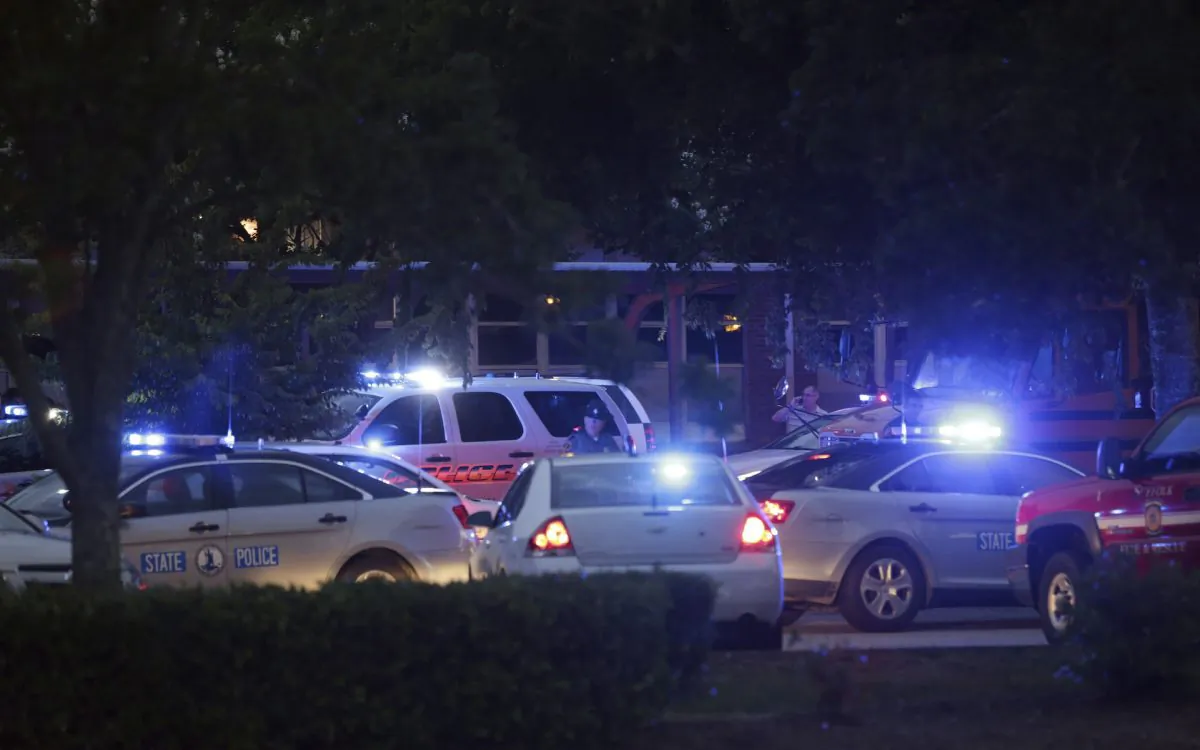 Emergency vehicles fill the parking lot at the Princess Anne Middle School in Virginia Beach, Va, on Friday, May 31, 2019. (AP Photo/Vicki Cronis-Nohe)