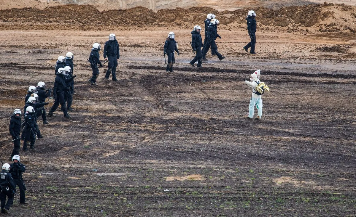 Police blocks environmental protesters at the open-cast brown coal mining Hambach near Kerpen, Germany, on Nov. 5, 2017.   Lukas Schulze/Getty Images