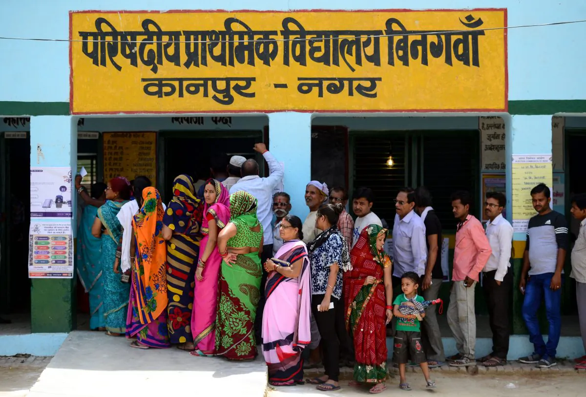 Indian voters stand in a line to cast their vote at a polling station in Kanpur on April 29, 2019. (Sanjay Kanojia/AFP/Getty Images)