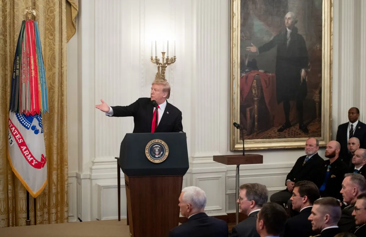 US President Donald Trump speaks prior to awarding a posthumous Medal of Honor for US Army Staff Sergeant Travis Atkins during a ceremony in the East Room of the White House in Washington, DC, March 27, 2019. SAUL LOEB/AFP/Getty Images
