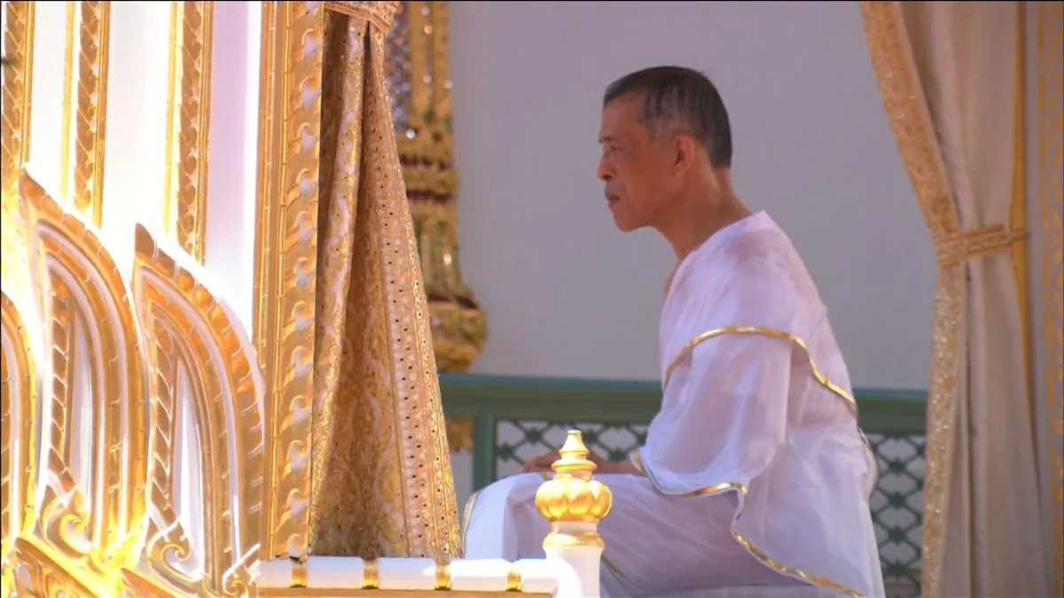 Thailand's King Maha Vajiralongkorn, donning white robes, undergoes a purification ritual during a ceremony before being officially crowned in Bangkok, Thailand, May 4, 2019. (Reuters still image/Reuters TV)