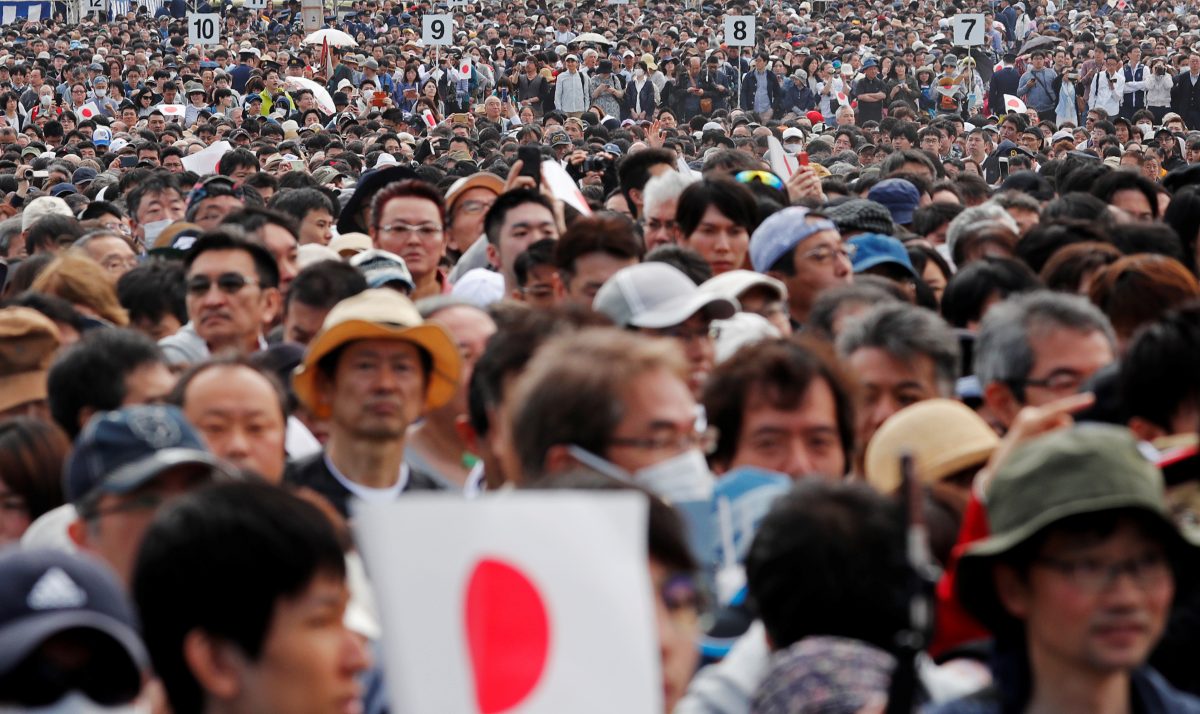 People wait in line to enter the Imperial Palace