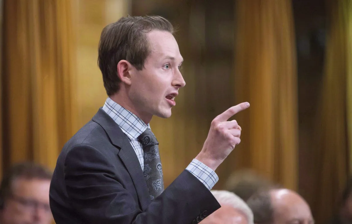 Conservative MP Michael Cooper rises during question period on Parliament Hill in Ottawa in this file photo. (The Canadian Press/Adrian Wyld)