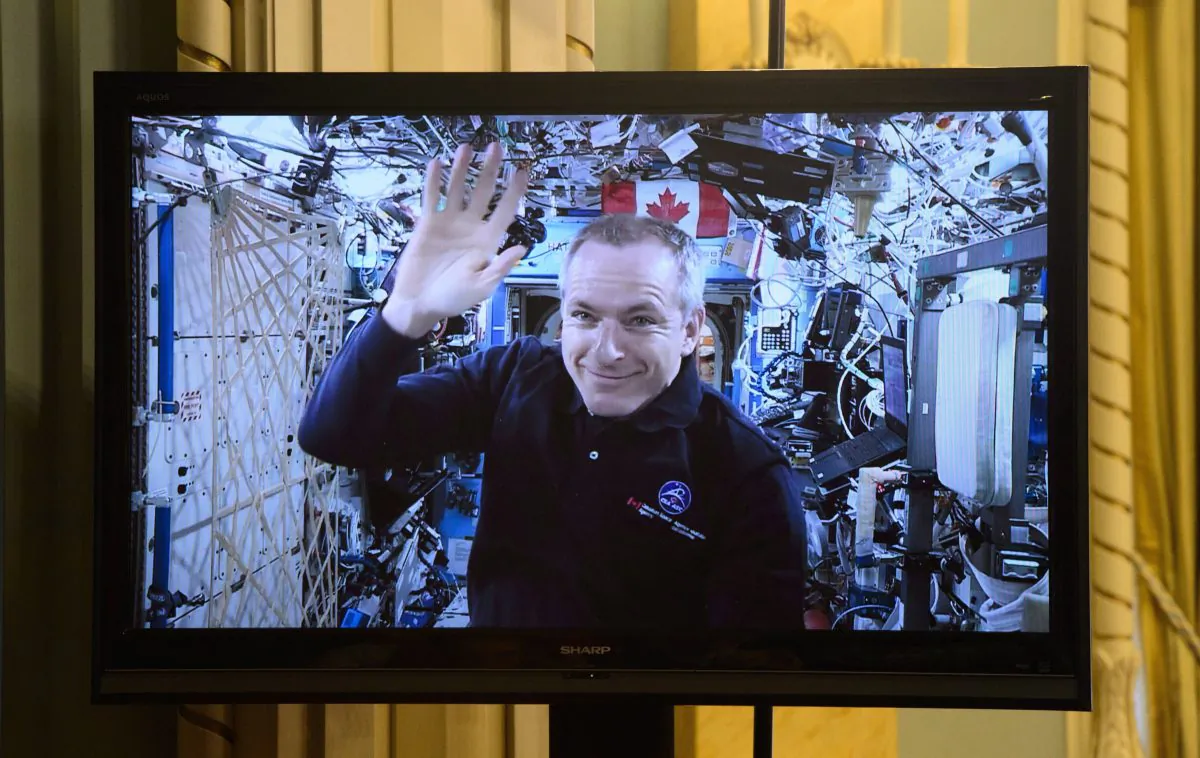 Canadian Space Agency astronaut David Saint-Jacques is seen on a live monitor from the International Space Station during a video conference with Prime Minister Justin Trudeau and Governor General Julie Payette and a group of students at Rideau Hall in Ottawa on Jan. 14, 2019. (The Canadian Press/Sean Kilpatrick)