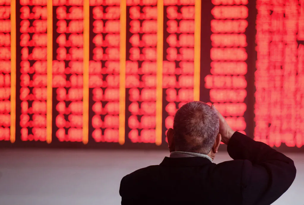 An investor monitors stock prices at a securities company in Hangzhou, Zhejiang Province on Dec. 3, 2018. (STR/AFP/Getty Images)