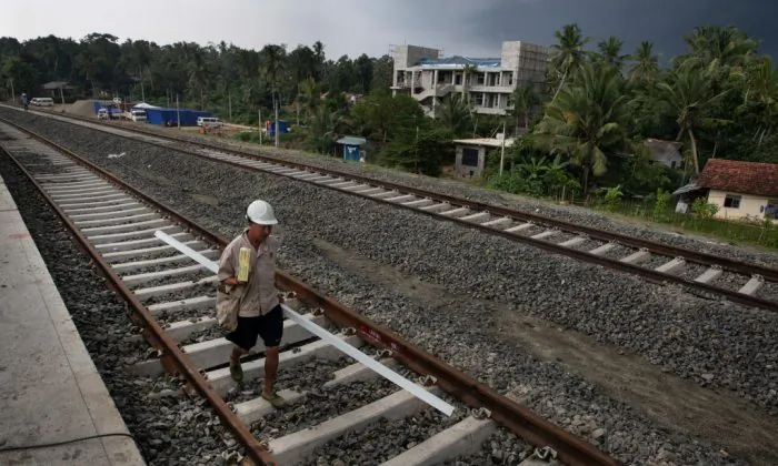 Chinese workers help to build a new train station in Beliatta, Sri Lanka which is Chinese managed and designed on Nov. 18, 2018 (Paula Bronstein/Getty Images)
