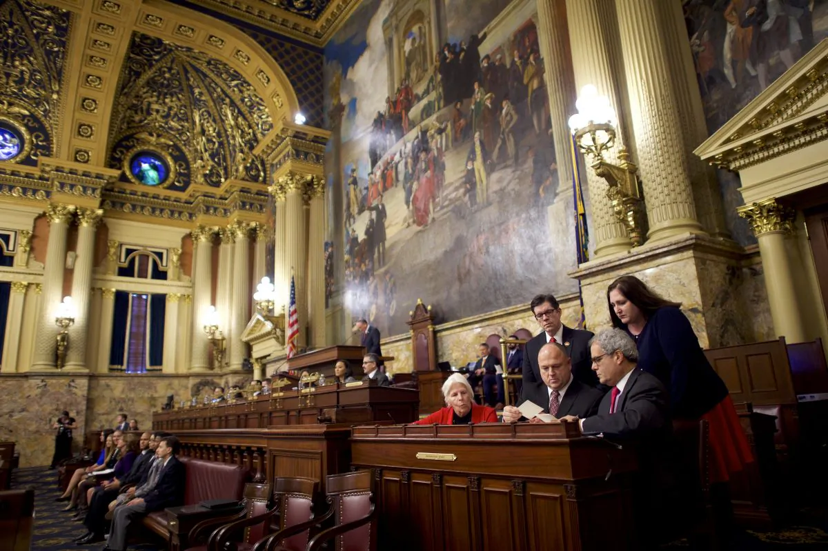 (R) Charlie Gerow and fellow tellers count the elector's votes from a ballot box in the House of Representatives chamber of the Pennsylvania Capitol Building December 19, 2016 in Harrisburg, Pennsylvania. Mark Makela/Getty Images