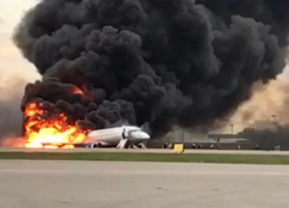 A passenger plane is seen on fire after an emergency landing at the Sheremetyevo Airport outside Moscow on May 5, 2019. (The Investigative Committee of Russia/Handout via Reuters)