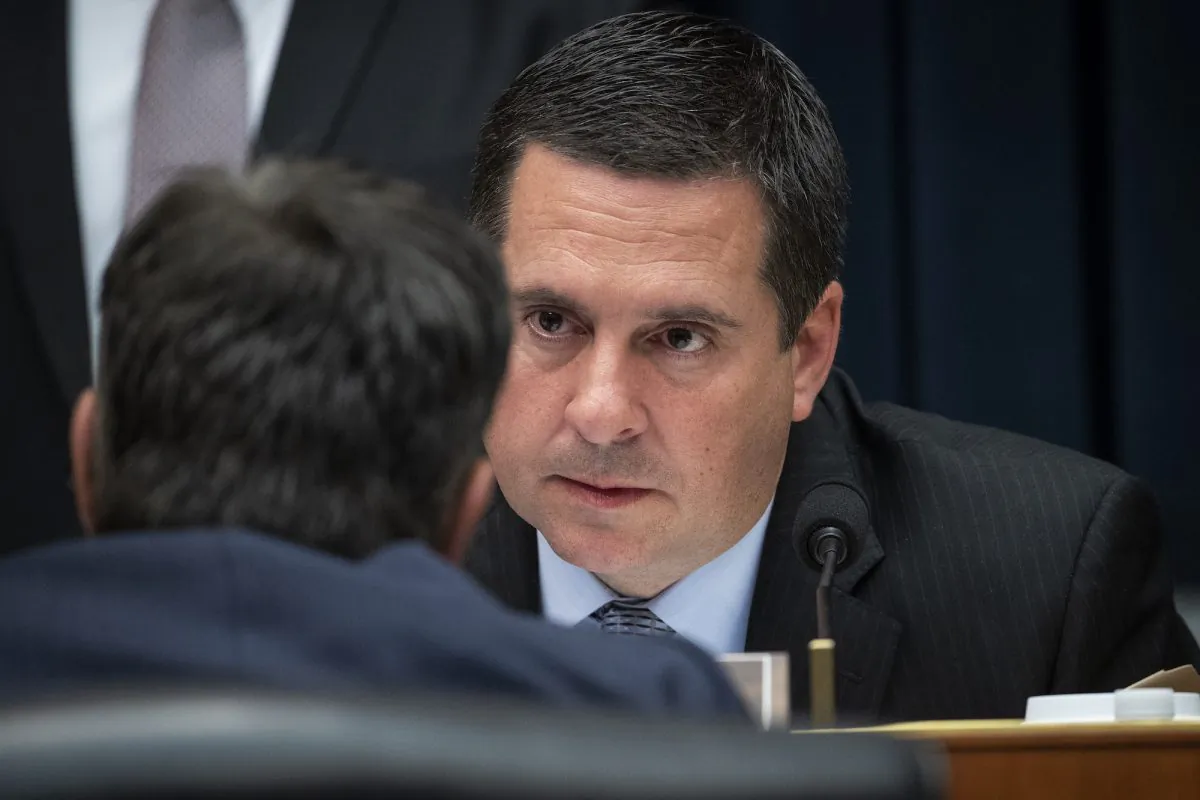 House Select Committee on Intelligence ranking member Devin Nunes (R-CA) confers with Rep. John Ratcliffe (R-TX) (back to camera) during a hearing concerning 2016 Russian interference tactics in the U.S. elections, in the Rayburn House Office Building, March 28, 2019 in Washington. (Drew Angerer/Getty Images)