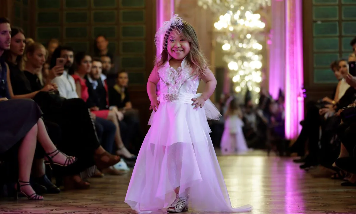 A model presents a creation during the International Dwarf Fashion Show. (Thomas Samson/AFP/Getty Images)