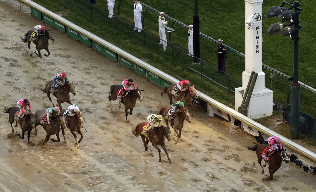Luis Saez rides Maximum Security to the finish line first against Flavien Prat on Country House during the 145th running of the Kentucky Derby horse race at Churchill Downs on May 4, 2019. (Charlie Riedel/AP Photo)
