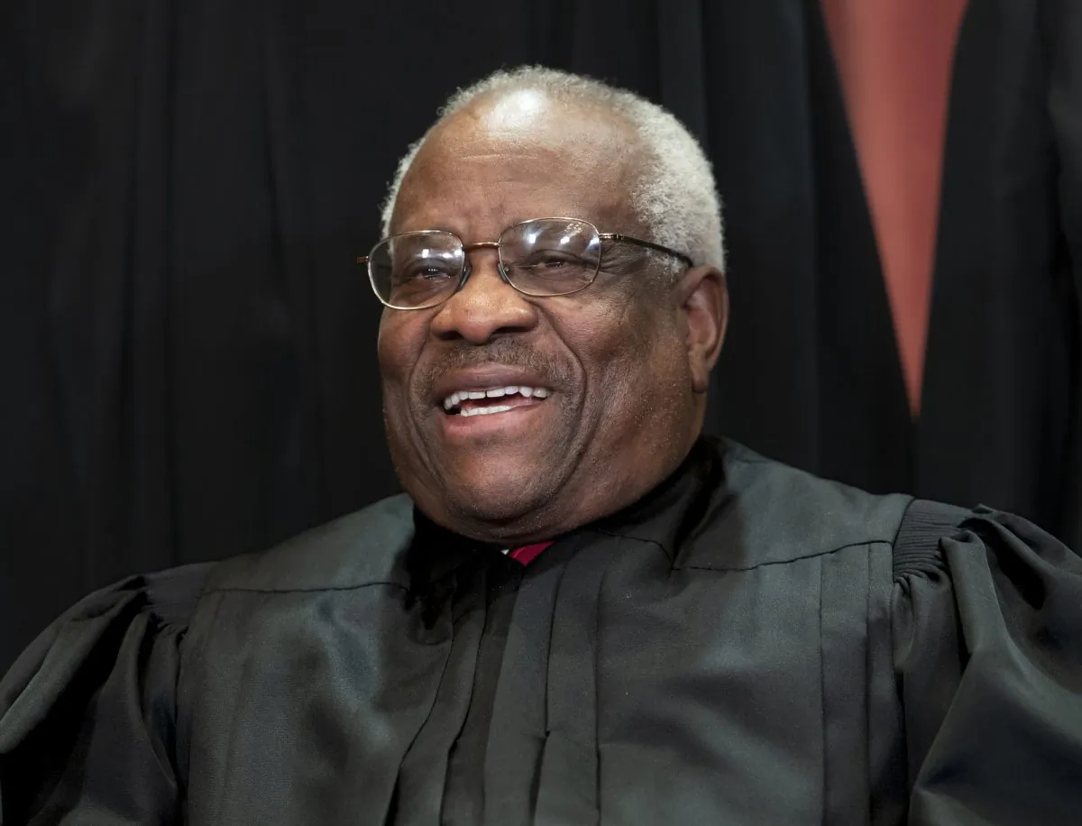 Supreme Court Associate Justice Clarence Thomas, appointed by President George H. W. Bush, sits with fellow Supreme Court justices for a group portrait at the Supreme Court Building in Washington, on Nov. 30, 2018. (J. Scott Applewhite/AP Photo)