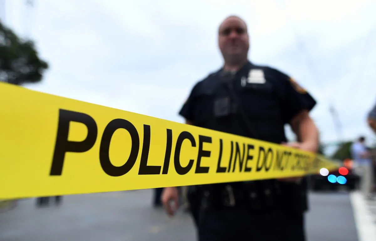 A police officer stands near police tape in a file photo. (Jewel Samad/AFP/Getty Images)