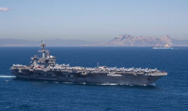 The Nimitz-class aircraft carrier USS Abraham Lincoln transits the Strait of Gibraltar, entering the Mediterranean Sea