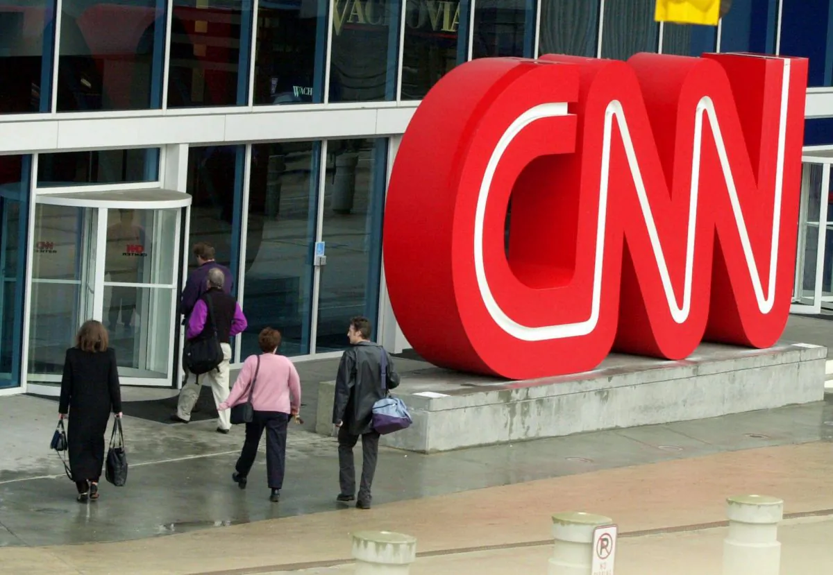 People enter the CNN Center, the headquarters for CNN, in downtown Atlanta in a file photo. (Ric Feld,File/AP Photo)