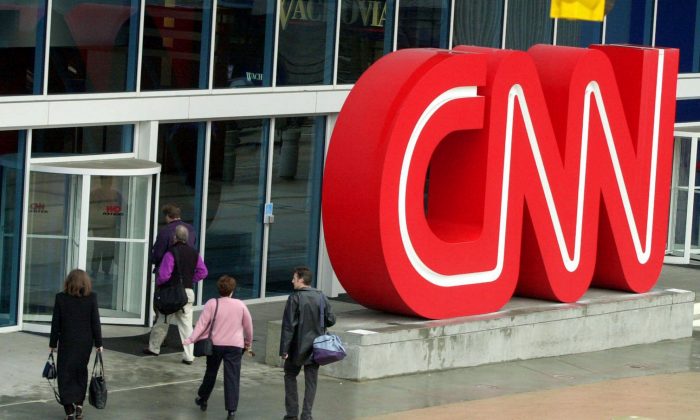 People enter the CNN Center, the headquarters for CNN, in downtown Atlanta in a file photo. (Ric Feld,File/AP Photo)