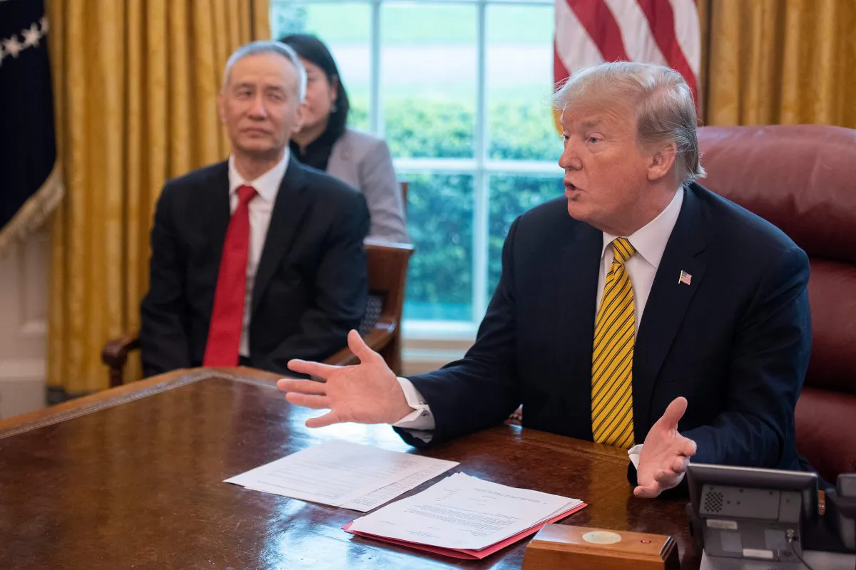 US President Donald Trump (R) speaks during a trade meeting with China's Vice Premier Liu He (C) in the Oval Office at the White House in Washington, DC, on April 4, 2019. (JIM WATSON/AFP/Getty Images)