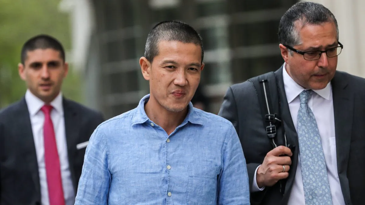 Ex-Goldman Sachs banker Roger Ng and his lawyer Marc Agnifilo leave the federal court in New York on May 6, 2019. (Jeenah Moon/Reuters)