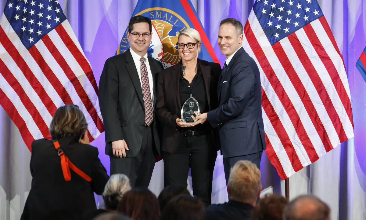 Stephanie Vitori, owner of Cheeseburger Baby from Miami, Florida receives the Phoenix Award for Disaster Recovery from Chris Pilkerton (R), acting administrator of U.S. Small Business Administration, at the 2019 National Small Business Week Awards Ceremony at the United States Institute of Peace in Washington on May 5, 2019. (Samira Bouaou/The Epoch Times)