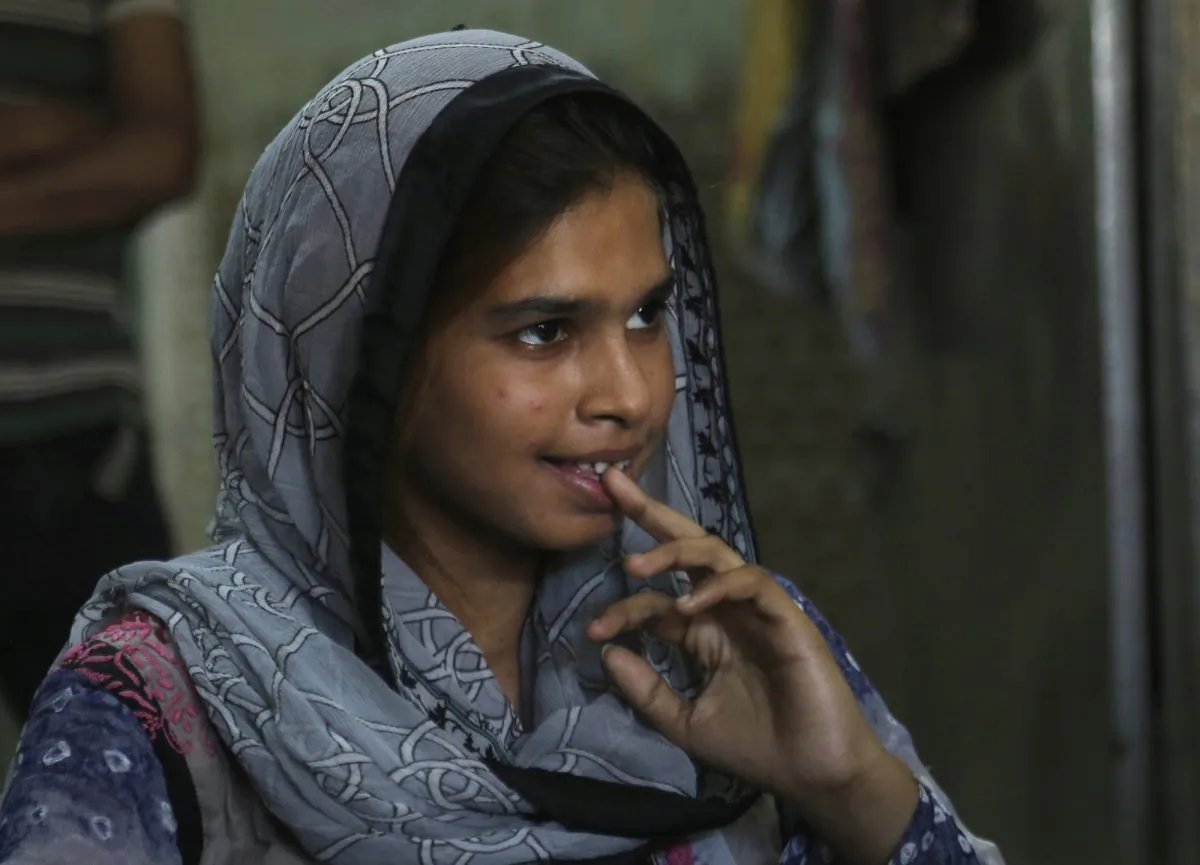 Muqadas Ashraf speaks to The Associated Press in Gujranwala, Pakistan on April 14, 2019. Muqadas Ashraf was just 16 when her parents married her off to a Chinese man who had come to Pakistan looking for a bride. Less than five months later, Muqadas is back home in Pakistan, pregnant and seeking a divorce from a husband she says was abusive. (K.M. Chaudary/AP Photo)