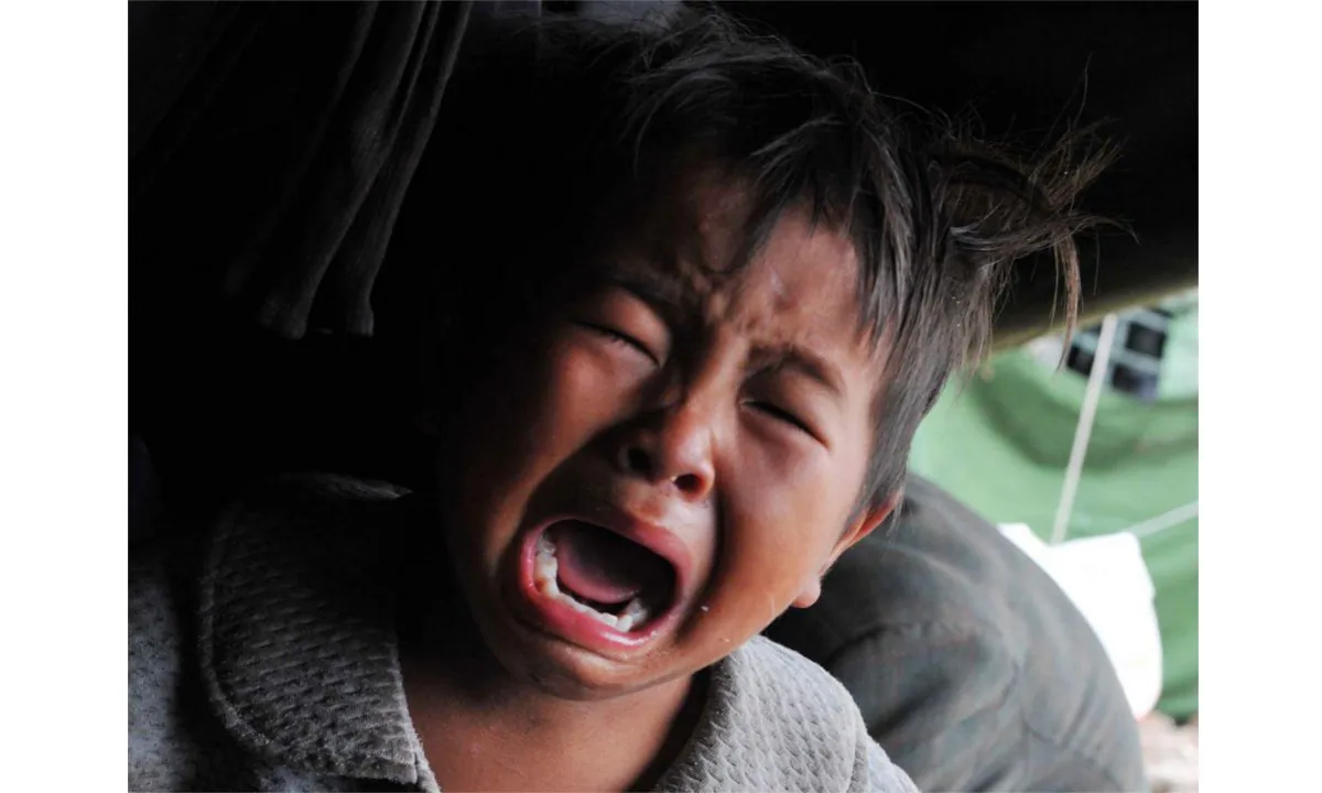 A crying boy. (STR/AFP/Getty Images)