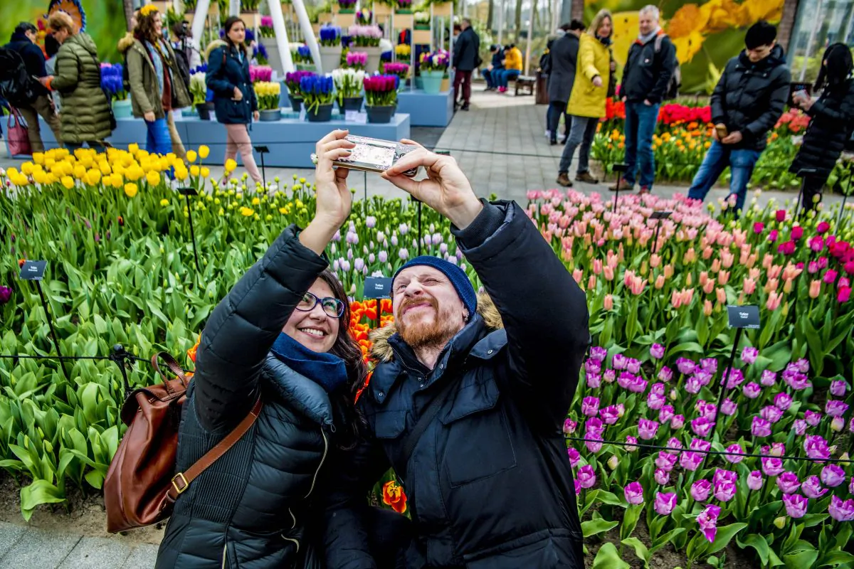 Tourists take selfies among tulips at the Keukenhof garden in Lisse, Netherlands, in this file photo. (Robin Utrecht/AFP/Getty Images)  