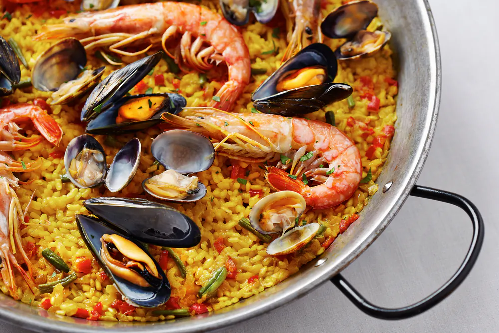 A hearty pan of paella, always served family-style, is a Spanish tradition. (Shutterstock)