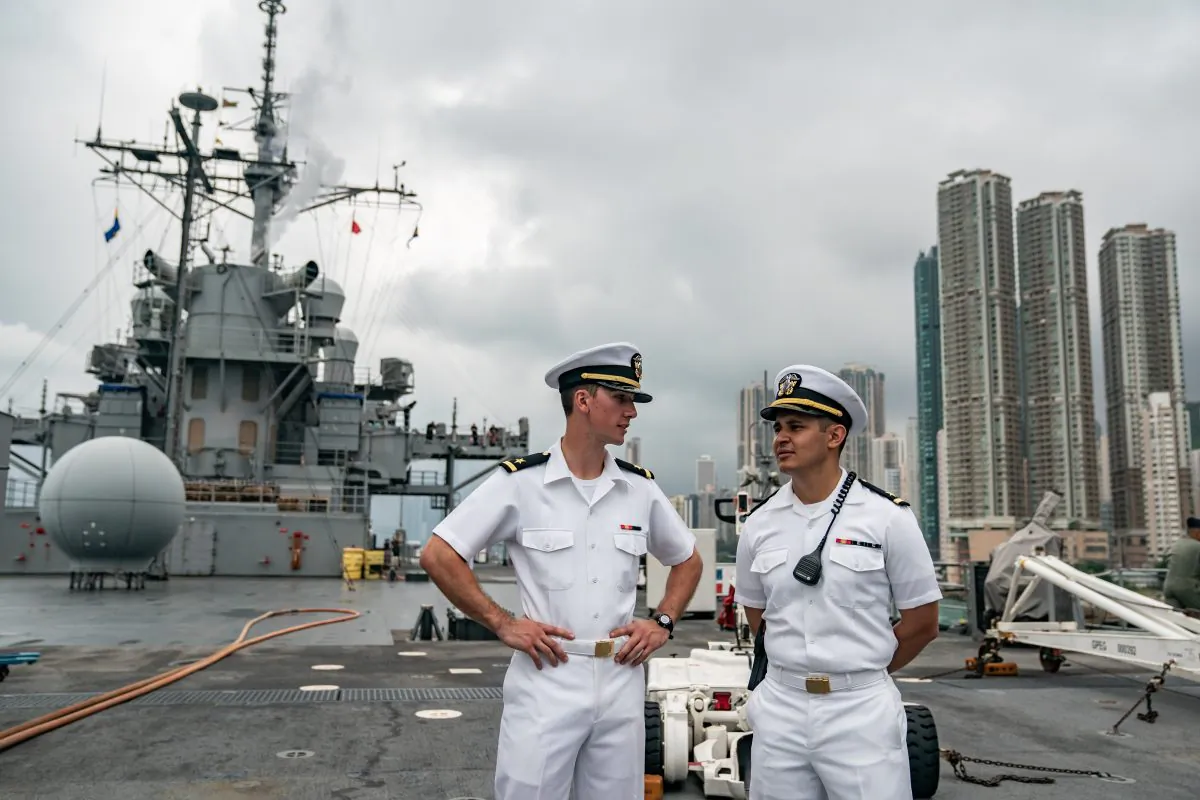 Navy crew members stand on deck of the USS Blue Ridge during a port call in Hong Kong on April 20, 2019. (Photo by Anthony Kwan/Getty Images)