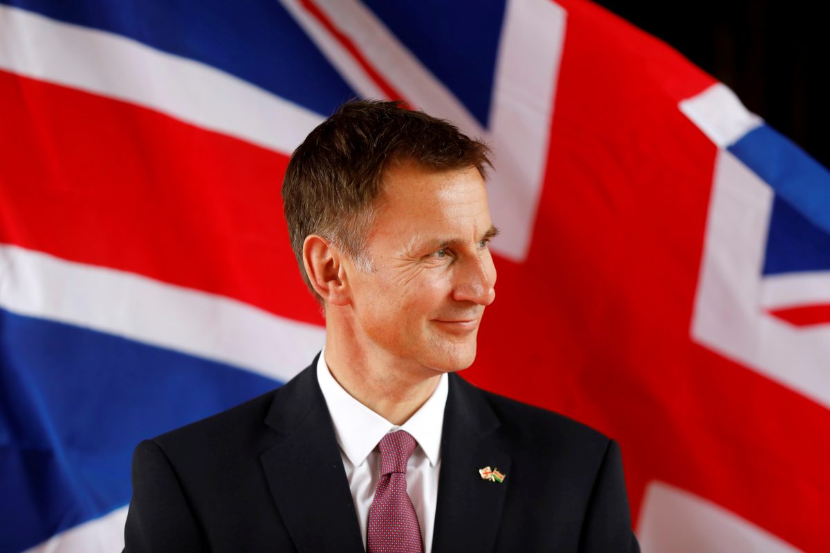 Britain's Foreign Secretary Jeremy Hunt looks at Kenya's Foreign Affairs Cabinet Secretary Monica Juma
