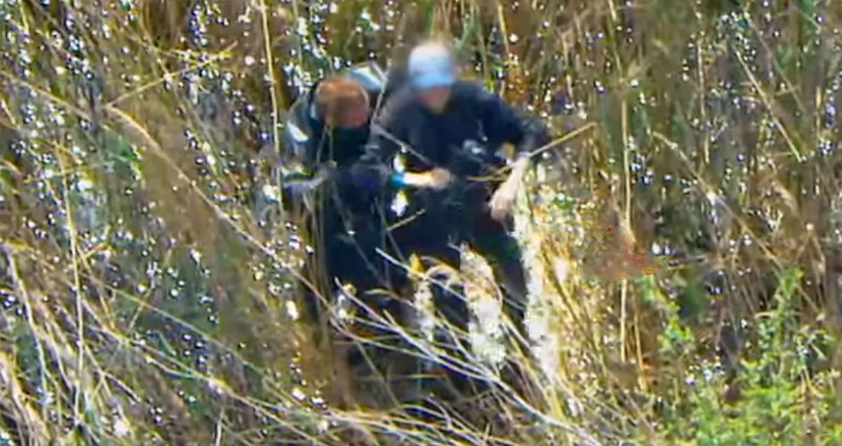 New York Police Department Detective Sean Daly (L) rescues an elderly man , 83, on Staten Island, N.Y., on May 2, 2019. (Courtesy of NYPD)