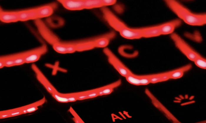 Close-up of keys on red backlit keyboard. (Unsplash)
