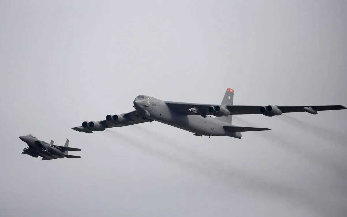 A U.S. Air Force B-52 (R) flies over Osan Air Base in Pyeongtaek, South Korea, on Jan. 10, 2016. (Reuters/Kim Hong-Ji/File Photo)