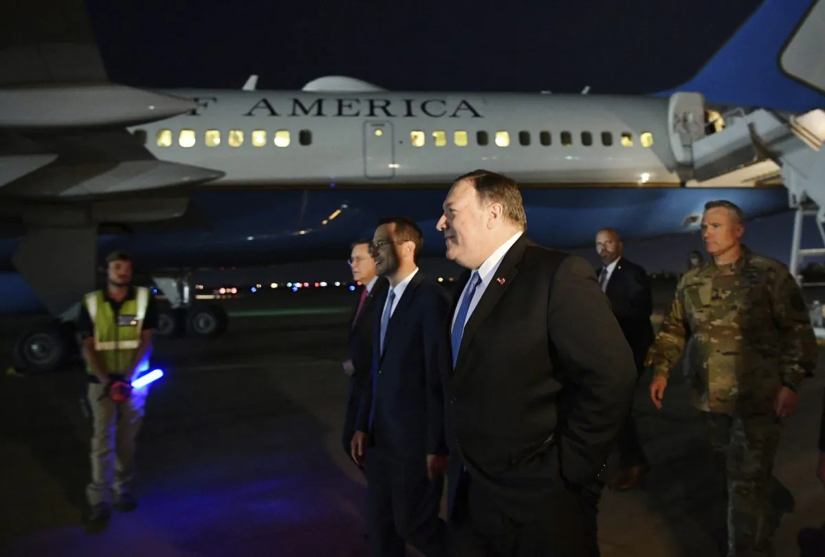 U.S. Secretary of State Mike Pompeo, center, walks with Acting Assistant Secretary for Near Eastern Affairs at the State Department David Satterfield, left, and Charge D'affaires at the U.S. Embassy in Baghdad Joey Hood, second from left, and Lt. Gen. Paul LeCamera after arriving in Baghdad, late Tuesday, May 7, 2019.  ((Mandel Ngan/Pool Photo via AP)