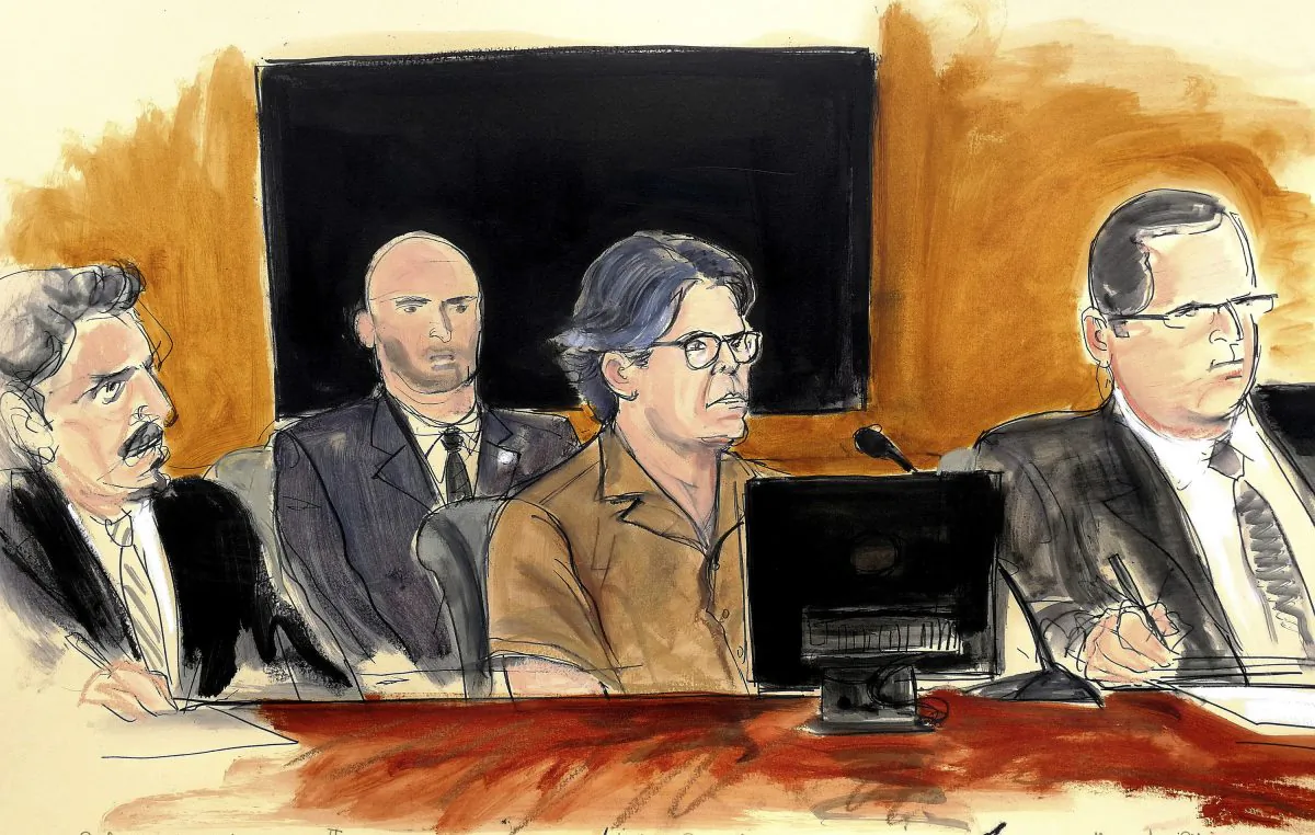 In this April 13, 2018, courtroom sketch, Keith Raniere, second from right, leader of the secretive group NXIVM, attends a hearing at court in the Brooklyn borough of New York. (Elizabeth Williams via AP, File)