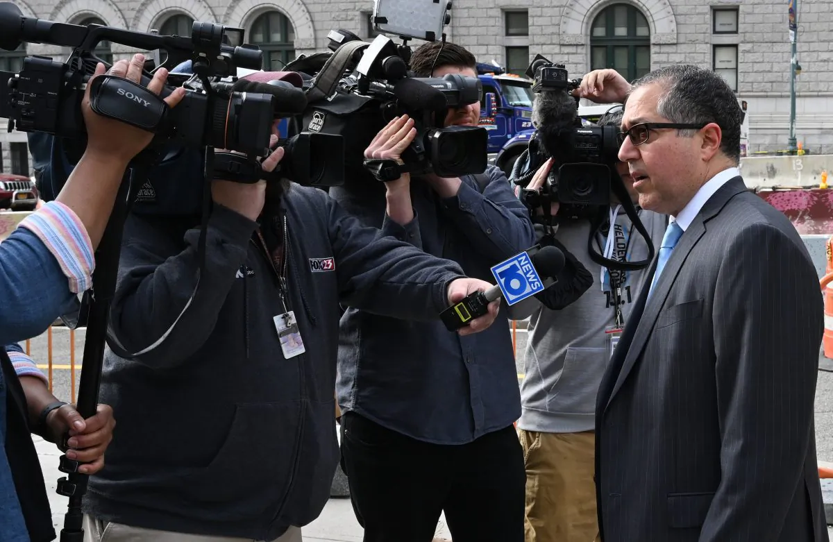 Keith Raniere's lawyer, Marc Agnifilo, speaks to the press as he arrives at Brooklyn Federal Court in New York on May 7, 2019. (Timothy A. Clary/AFP/Getty Images)