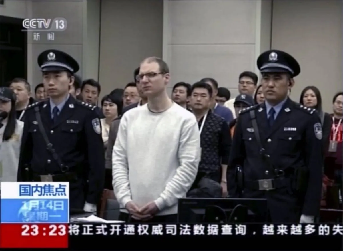 Video footage run by China's CCTV shows Canadian Robert Lloyd Schellenberg at his retrial held in Dalian Intermediate People's Court in Dalian, Liaoning Province, China. A Chinese court has held an appeal hearing on May 9 for the Canadian who was sentenced to death for drug smuggling. No decision was immediately announced after the hearing. (CCTV via AP)