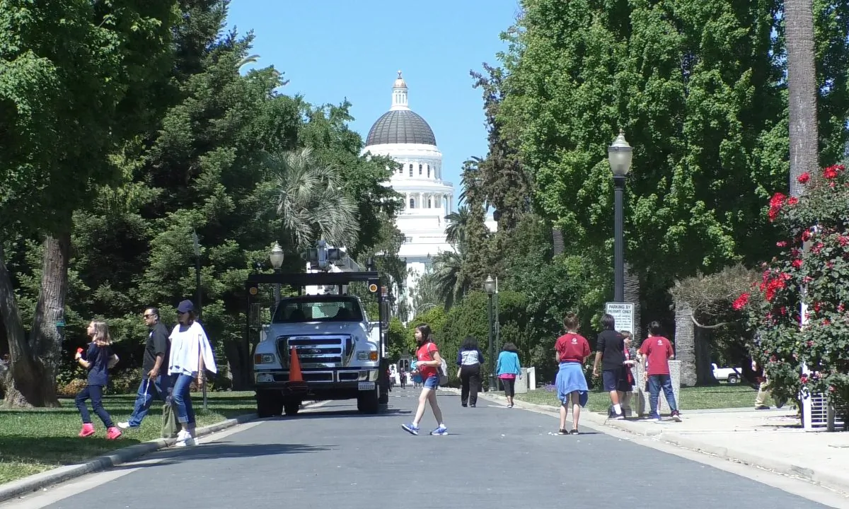 People walking near the capitol building in Sacramento, Calif., on May 8, 2019. (Daniel Holl/The Epoch Times)