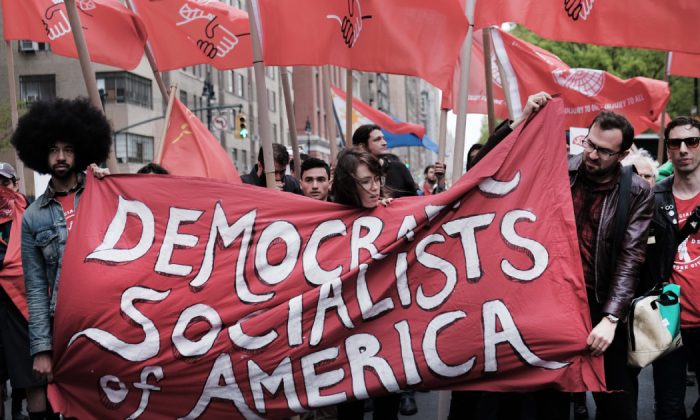 Members of the Democratic Socialists of America gather outside a Trump-owned building on May Day in New York City on May 1, 2019. (Spencer Platt/Getty Images)