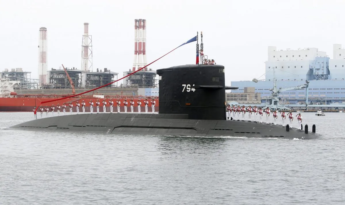 Taiwan navy sailors salute from a Dutch Zwaardvis-class submarine during a groundbreaking ceremony for the island's submarine factory in Kaohsiung, southern Taiwan on May 9, 2019. (Chiang Ying-ying/AP Photo)