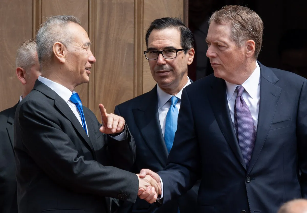 Chinese Vice Premier Liu He (L) shakes hands with US Trade Representative Robert Lighthizer (R) alongside US Treasury Secretary Steven Mnuchin (C) as Liu leaves the Office of the United States Trade Representative after trade negotiations in Washington, DC, May 10, 2019. (Saul Loeb/AFP/Getty Images)