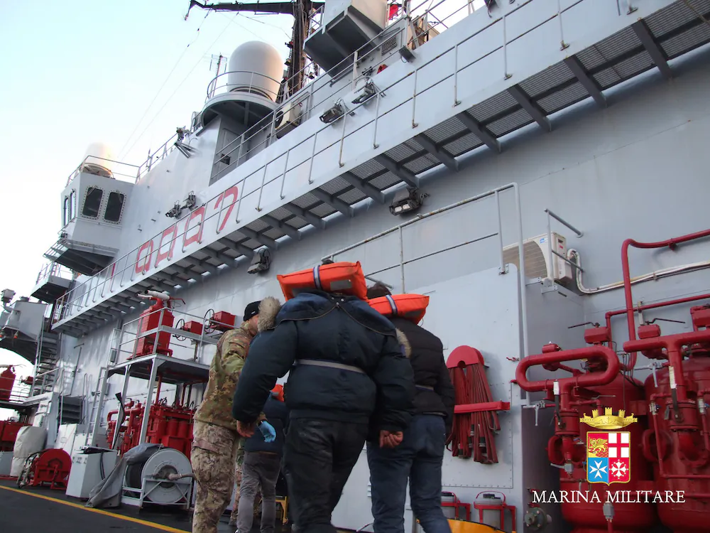 In this image released by the Italian Navy, passengers of the Italian-flagged Norman Atlantic, that caught fire in the Adriatic Sea, are rescued from the Italian Navy ship San Giorgio, on Dec. 29, 2014. (Italian Navy/AP Photo)