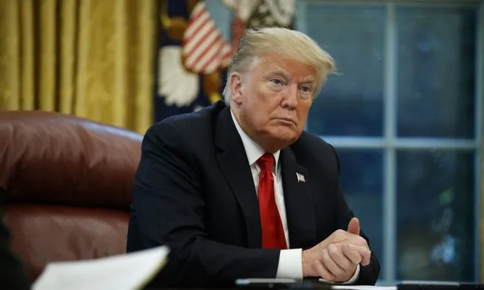 President Donald Trump listens to a question during an interview with The Associated Press in the Oval Office of the White House, on Oct. 16, 2018. (Evan Vucci/AP Photo)