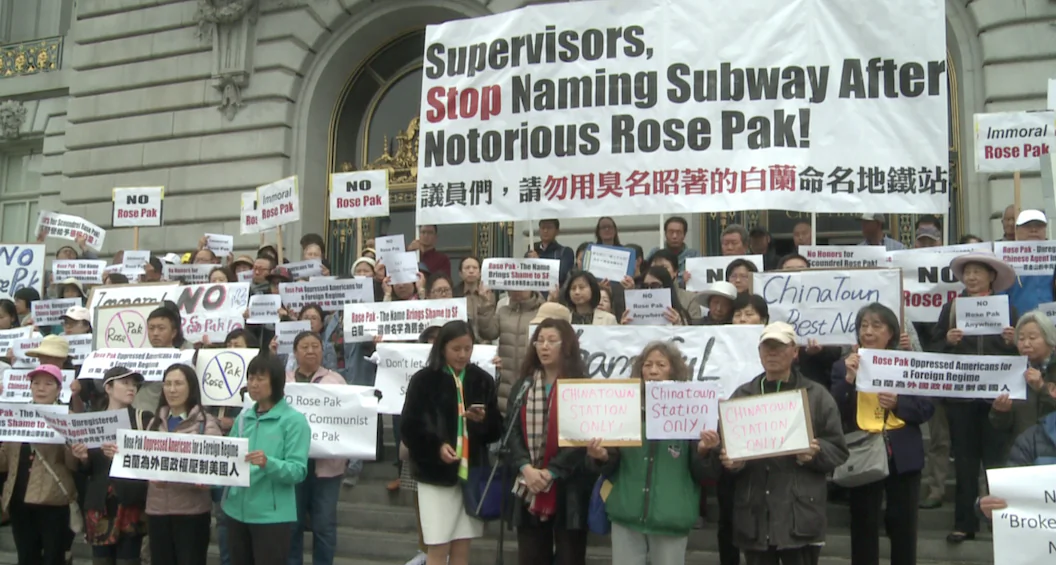 Rally participants holding signs on the steps outside San Francisco City Hall on May 6, 2019. (Nan Su/The Epoch Times)