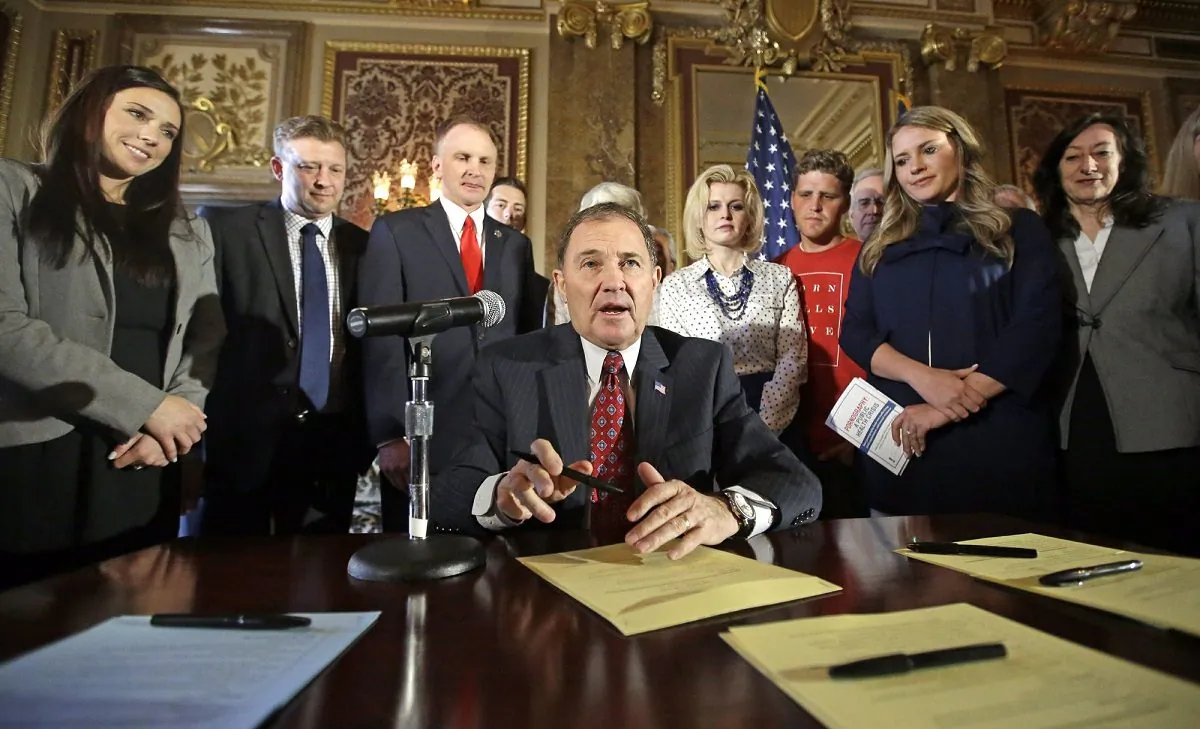 Utah Gov. Gary Herbert looks up during a ceremonial signing of a state resolution declaring pornography a public health crisis, at the Utah State Capitol, in Salt Lake City, on April 19, 2016. (Rick Bowmer/AP Photo)