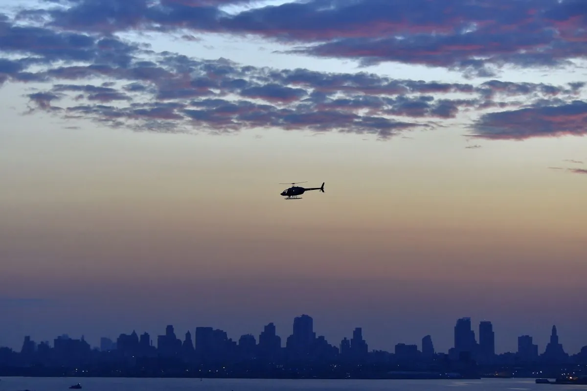 A helicopter flies over Brooklyn, New York City on July 1, 2017. (Loic Venance/AFP/Getty Images)