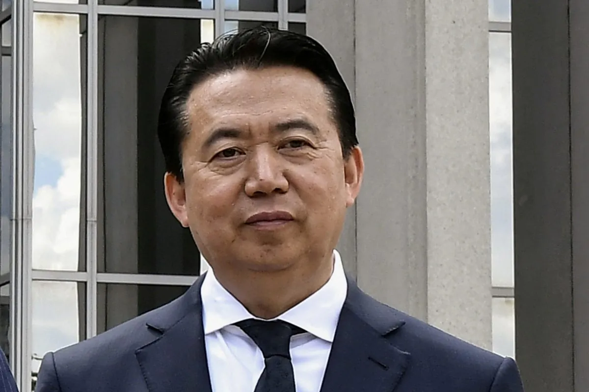 Meng Hongwei poses during a visit to the headquarters of International Police Organisation in Lyon, France, on May 8, 2018. (Jeff Pachoud/Pool via Reuters)