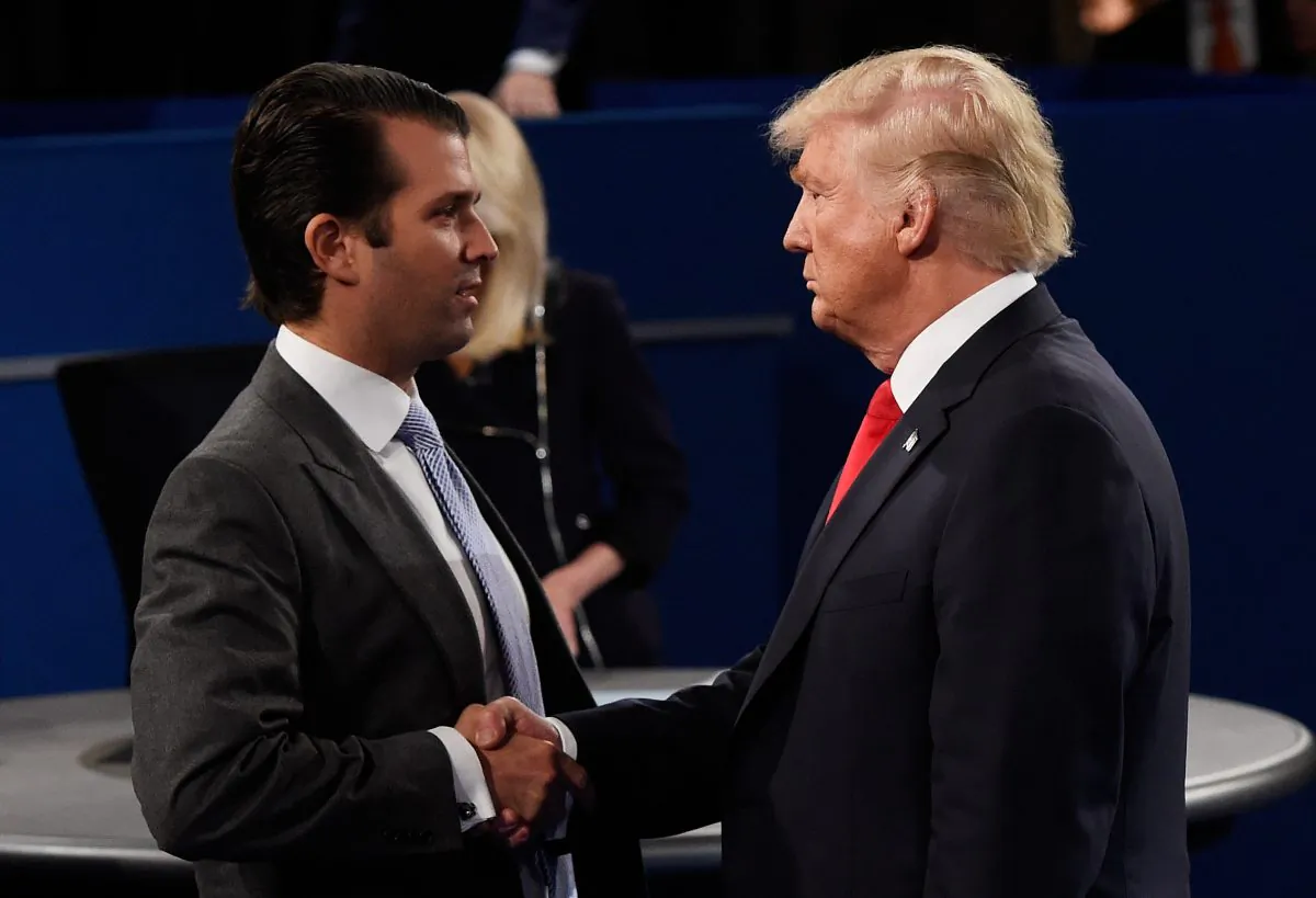 Donald Trump, Jr. (L) greets his father Republican presidential nominee Donald Trump during the town hall debate at Washington University in St Louis, Mo. on Oct. 9, 2016. (Saul Loeb-Pool/Getty Images)