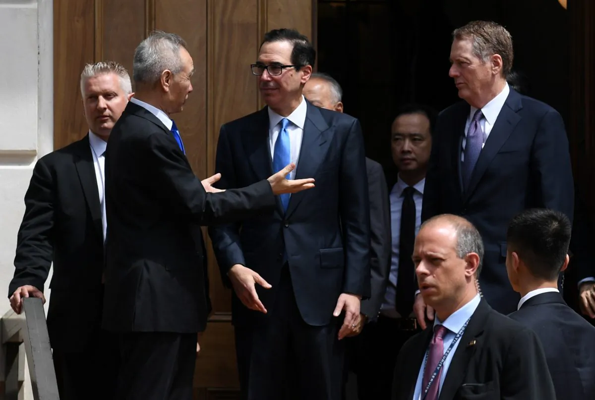 Chinese Vice Premier Liu He talks with U.S. Treasury Secretary Steven Mnuchin and Trade Representative Robert Lighthizer as he leaves trade talks in Washington, U.S., May 10, 2019. REUTERS/Leah Millis