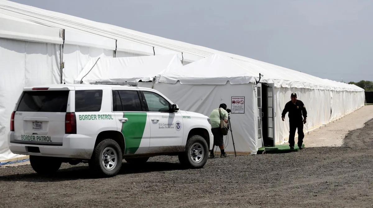 A security guard enters a new U.S. Customs and Border Protection temporary facility near the Donna International Bridge in Donna, Texas, on May 2, 2019. (Eric Gay/Photo via AP)