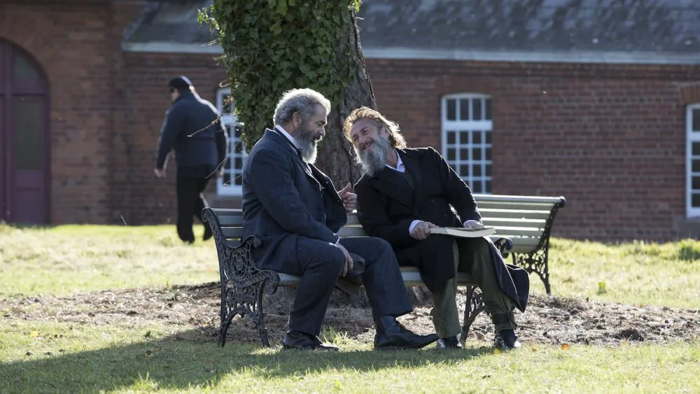 Mel Gibson (L) and Sean Penn star in “The Professor and the Madman.” (Patrick Redmond/ Vertical Entertainment)